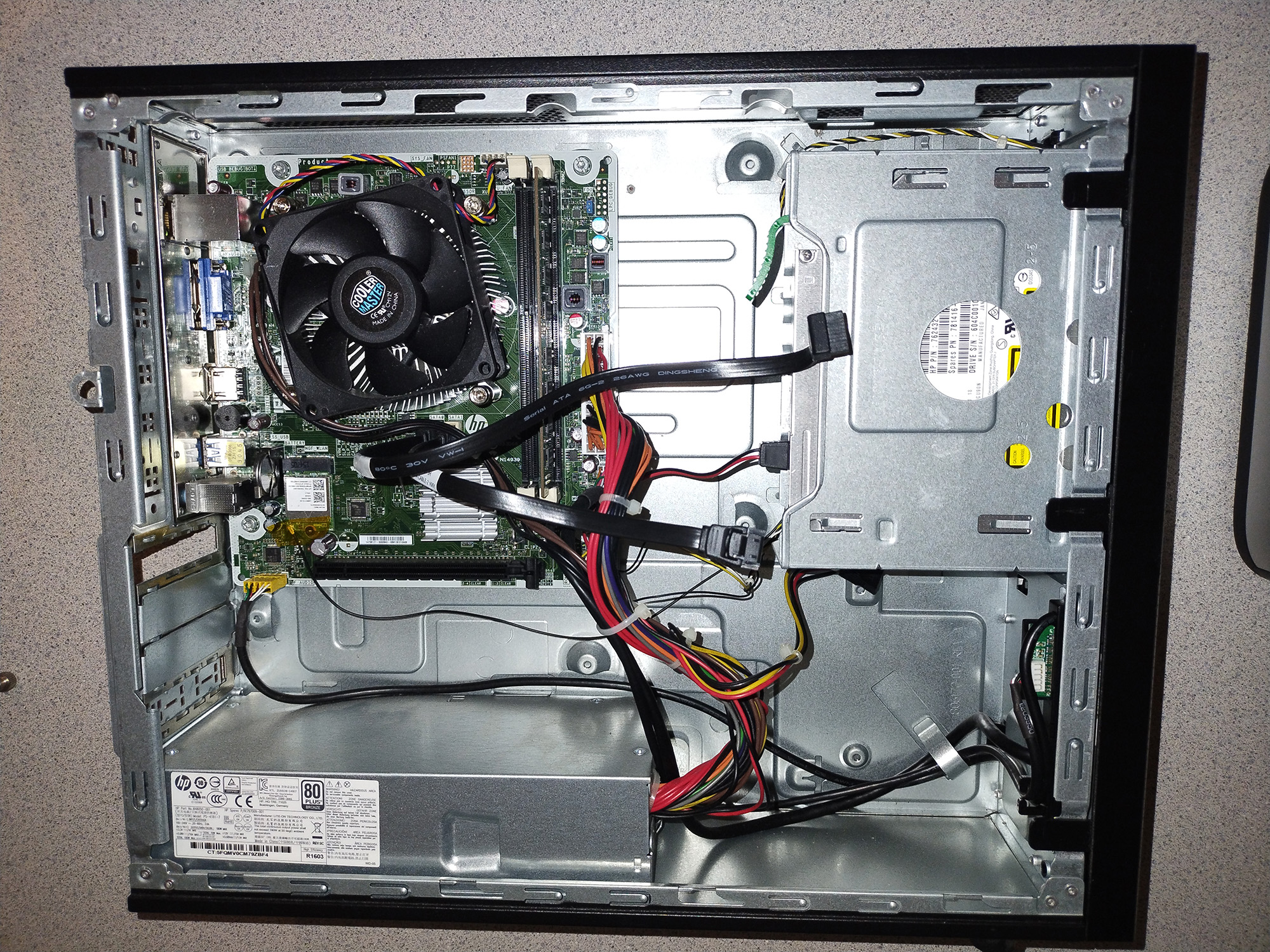 Interior of the 2013 HP office desktop case with no hard drive.